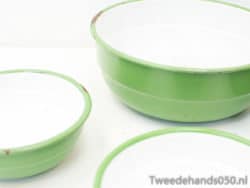 Vintage green bowls with white interiors, perfect for serving and charming kitchen decor.