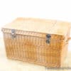 Rustic wicker storage basket with lid, ideal for vintage decor and practical organization.
