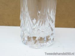Sleek crystal glass with geometric cuts, perfect for elegant dining and stylish decor.