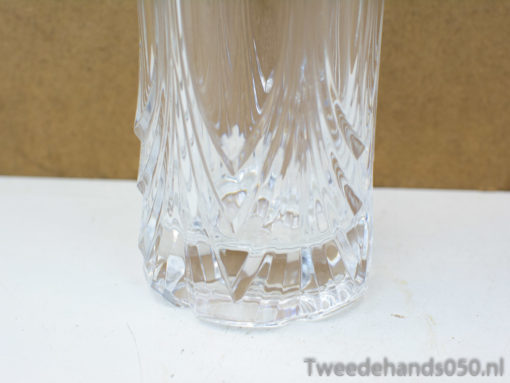 Sleek crystal glass with geometric cuts, perfect for elegant dining and stylish decor.