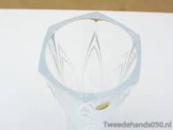 Stylish hexagonal glass vase with intricate engravings, perfect for contemporary home decor.