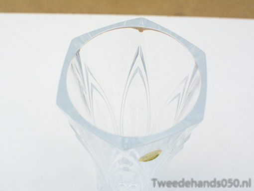 Stylish hexagonal glass vase with intricate engravings, perfect for contemporary home decor.