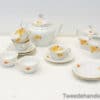 Elegant floral porcelain tea set with gold accents, ideal for afternoon tea gatherings.