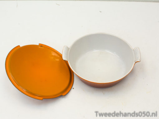 Vibrant orange and white casserole dish with lid, perfect for stylish cooking and serving.