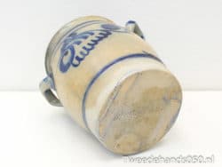 Antique ceramic jar with beautiful hand-painted blue designs for rustic home decor.