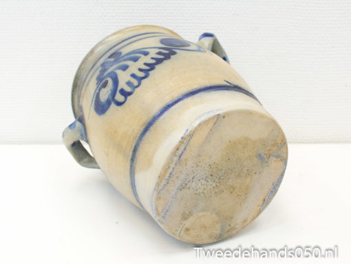 Antique ceramic jar with beautiful hand-painted blue designs for rustic home decor.