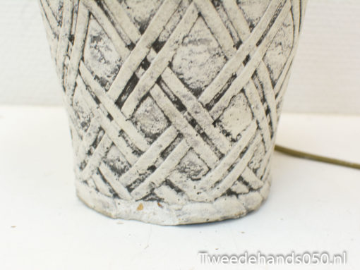 Stylish vintage pot with textured crisscross design, perfect for rustic home and garden decor.
