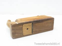 Timeless vintage wooden hand plane, essential for woodworking, showcasing expert craftsmanship and character.