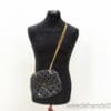 Chic black quilted handbag with gold chain strap, perfect for any stylish occasion.