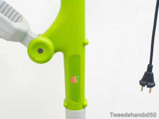 Eco-friendly green trimmer designed for effortless gardening and efficient lawn care.