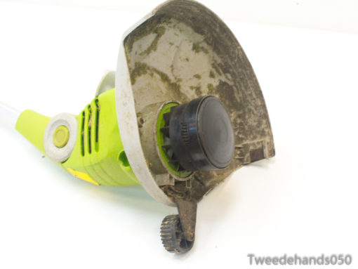 Powerful green electric trimmer designed for efficient lawn care and precise weed control.