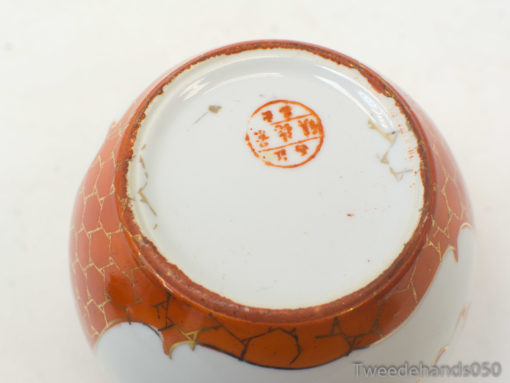 Vintage orange ceramic bowl with honeycomb design, showcasing charm and rich history.
