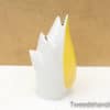 Stylish yellow and white ceramic flame sculpture, ideal for modern decor and artistic accents.