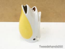 Cheerful yellow tulip vase with white accents, perfect for stylish floral displays and modern decor.