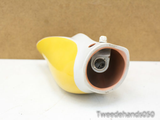 Charming yellow banana-shaped shoehorn adding playful retro flair to your home decor.