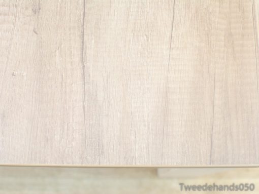 Elegant light wooden table showcasing unique grain patterns and a refined, rustic charm.