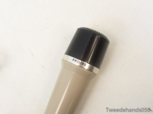 Vintage Philips microphone in black and beige, ideal for collectors and audio enthusiasts.
