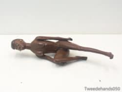 Stylish brown wooden figurine, embodying elegance and artistic charm for home decor enthusiasts.
