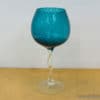 Elegant turquoise goblet with twisted stem and ribbed design, perfect for special occasions.