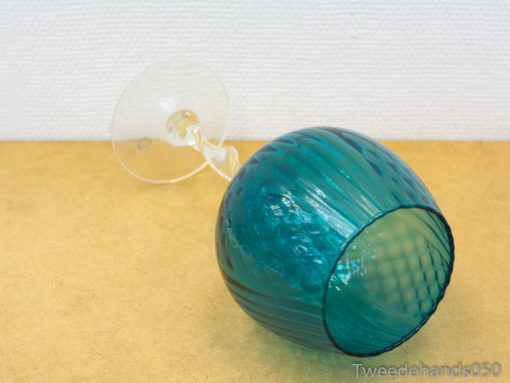 Unique teal goblet with playful texture, perfect for elegant decor and special occasions.