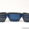 Elegant deep blue ceramic bowl set for stylish dining and versatile home decor.