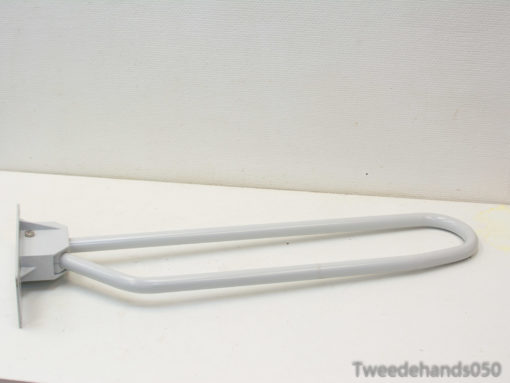 Ergonomic light gray wall hook for stylish and practical storage of clothes and accessories.