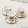 Elegant floral porcelain tea cups with gold accents for vintage tea parties and decor.