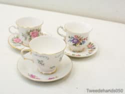 Elegant vintage teacup set with floral designs and gold accents, ideal for stylish tea gatherings.