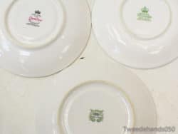 Elegant vintage porcelain plates featuring designs by Queen Anne, Royal Standard, and Haviland.
