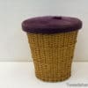 Chic wicker basket with a soft purple lid for elegant and functional storage solutions.