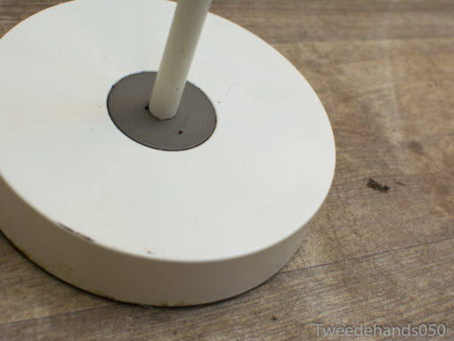 Sleek white lamp base with contrasting gray accents, adds charm to modern interiors.