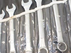 High-quality chrome wrench set (10-14mm) in clear holder for quick access and organization.