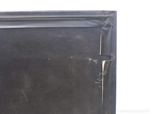 Worn black vintage frame with tape repairs, exuding charm, character, and rich history.