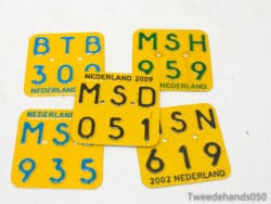 Explore unique vintage Dutch yellow license plates showcasing vibrant designs and rich automotive history.
