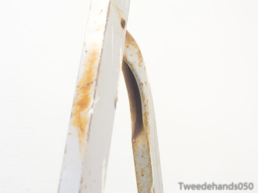 Vintage ladder with rustic charm, showcasing wear and character for timeless decor and functionality.