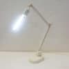 Sleek white LED desk lamp with adjustable arms for versatile and stylish workspace lighting.