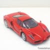 Vibrant red Ferrari Enzo miniature model, perfect for collectors and car enthusiasts alike.
