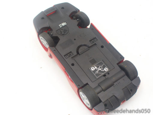 Vintage red 27 MHz RC car, perfect for outdoor racing adventures and young enthusiasts.