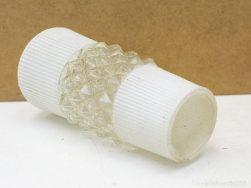 Vintage glass dispenser with diamond texture and ribbed white caps for elegant display.