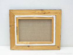 Rustic wooden frame with textured blank canvas, perfect for art projects and home decor.