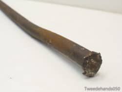 Rusty metal rod with character, ideal for vintage decor and creative projects.