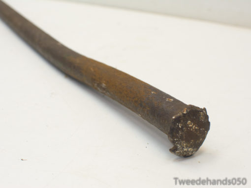 Rusty metal rod with character, ideal for vintage decor and creative projects.