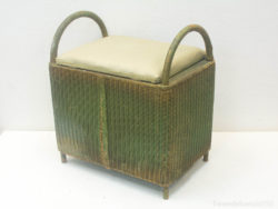 Charming wicker bench with cushion for stylish seating and storage in any interior decor.