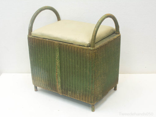 Charming wicker bench with cushion for stylish seating and storage in any interior decor.