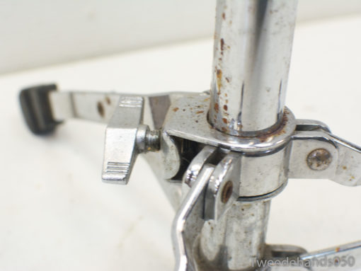 Vintage chrome clamp mechanism with wear, ideal for durable tool support and precision tasks.