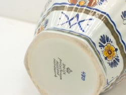 Vibrant hand-painted floral vase from 2012, showcasing exquisite craftsmanship and artistic elegance.