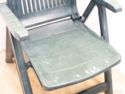 Stylish dark green outdoor chair, perfect for comfort and durability in gardens and patios.