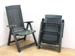 Durable outdoor chairs with a classic design, perfect for relaxation and space-saving storage.