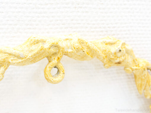 Pale yellow sculptural piece with organic shapes and texture, perfect for elegant decor.