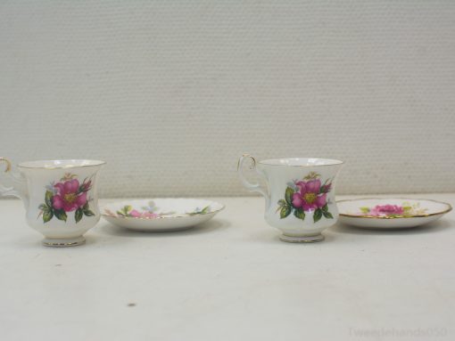 Floral porcelain tea set with gold accents, ideal for elegant gatherings and decorative displays.